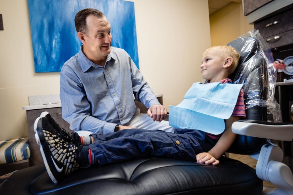 Dr. Troy with child patient