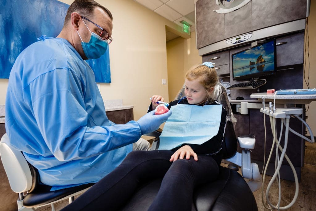 Thomas Dentistry Mercer Island Dentist Girl in Chair Brushing