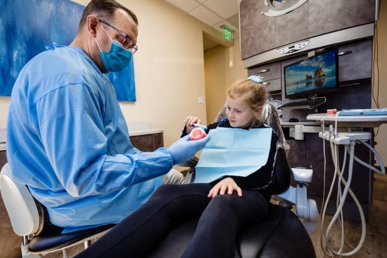Thomas Dentistry Mercer Island Dentist Girl in Chair Brushing